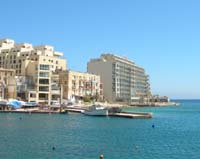 Photograph on the right of the Cavalieri Hotel, Spinola bay, St. Julian's Malta